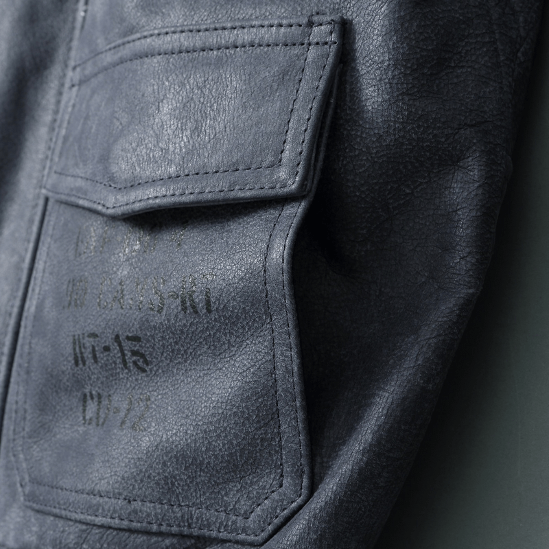 Close-up of a durable men’s motorcycle jacket pocket in genuine leather, showcasing quality and style.