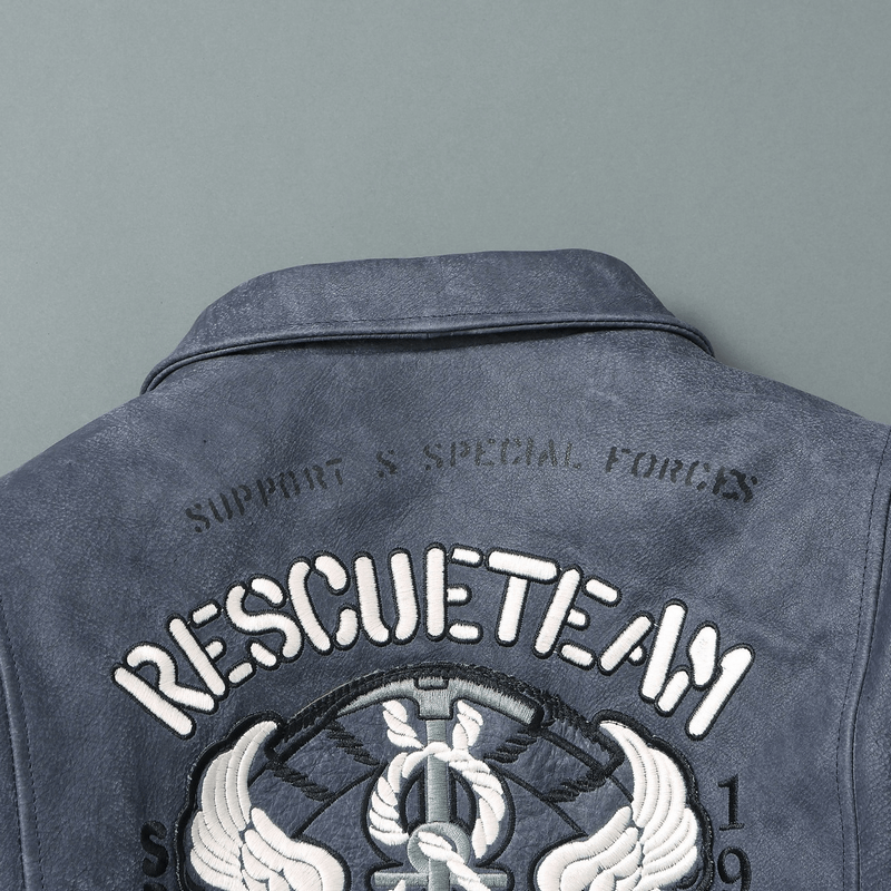 Close-up of the back of a men's leather motorcycle jacket with embroidered 'Rescue Team' and support logo.