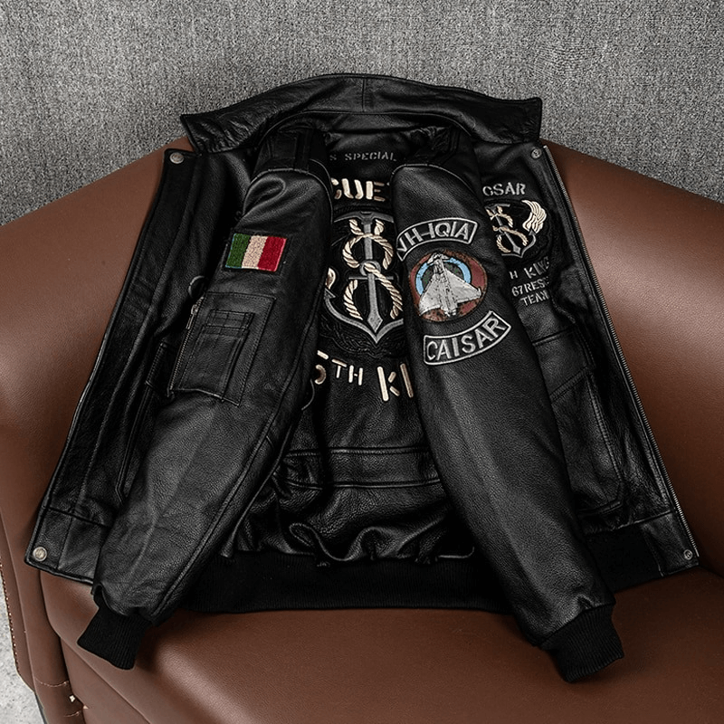 Men's black leather motorcycle jacket with embroidered patches and big pockets, stylish and functional design.