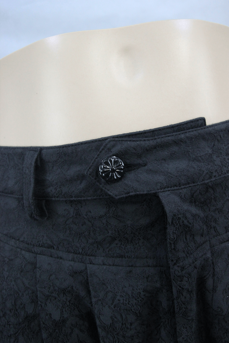 Close-up of men's black gothic pants waist with delicate pattern and stylish button detail.