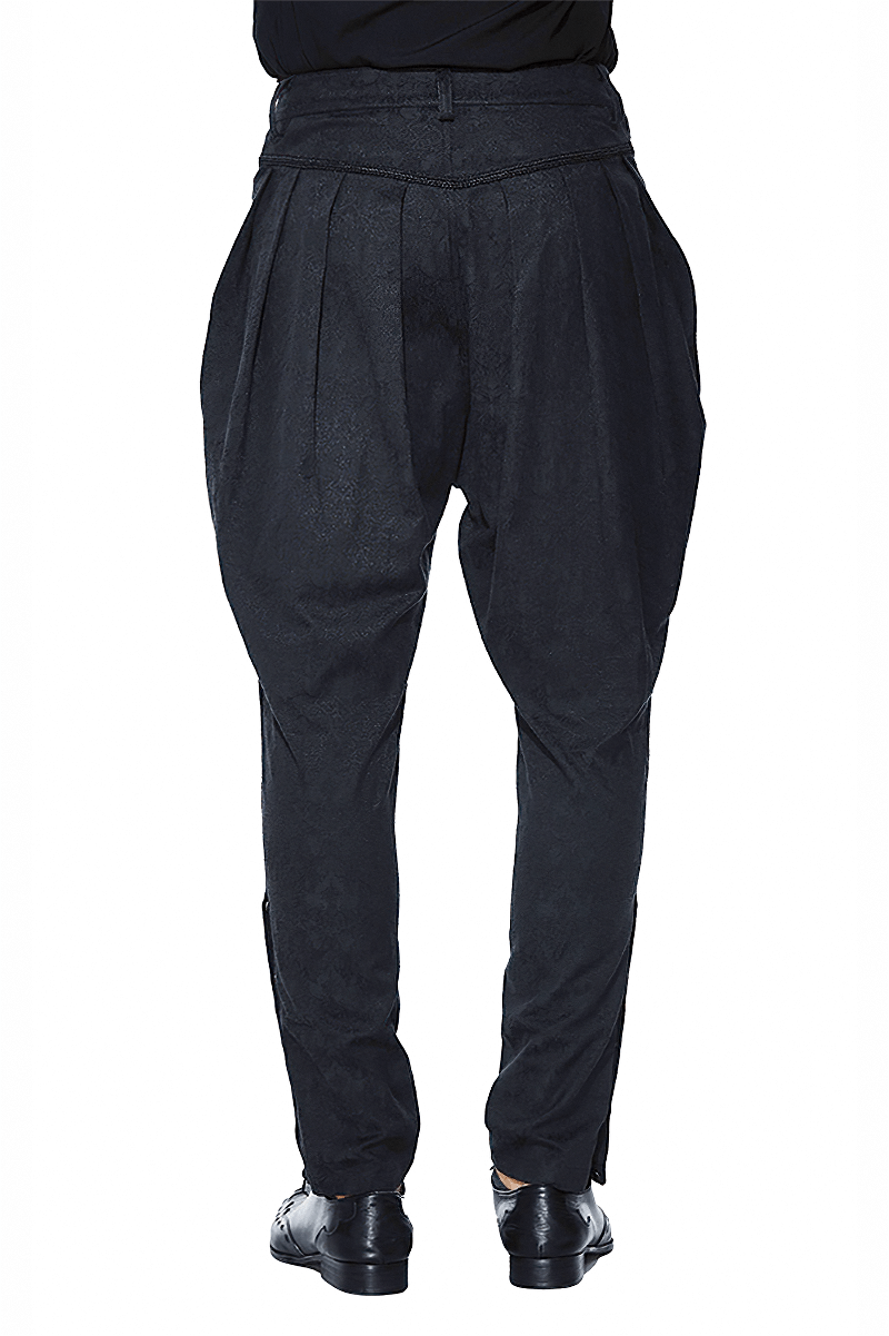 Back view of men's baggy black trousers with delicate pattern, perfect for a gothic style wardrobe.