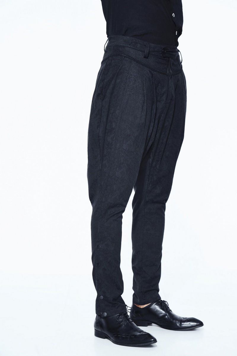 Men's goth baggy black tapered trousers with delicate pattern, perfect for a stylish gothic wardrobe.