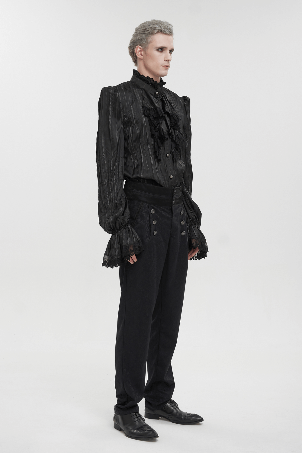 Stylish model wearing men's gothic puff-sleeved ruffled black shirt with intricate detailing and button accents.
