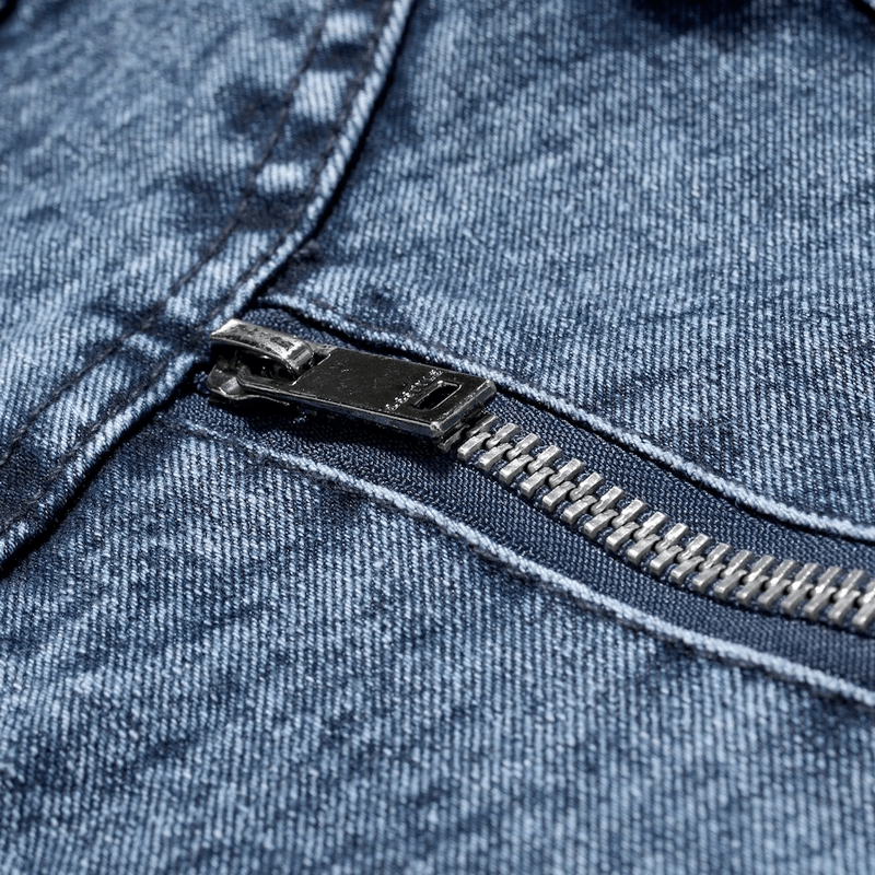 Close-up of a zipper on a men's denim jacket, showcasing quality fabric and stylish biker design.