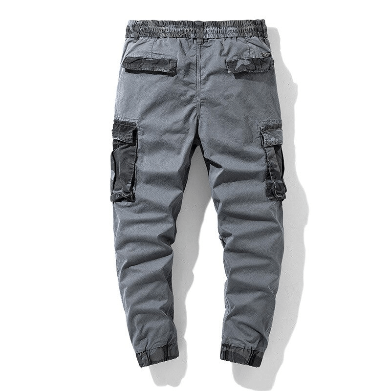 Men's gray cargo joggers with camouflage elements and elastic waist, perfect for trendy streetwear style.