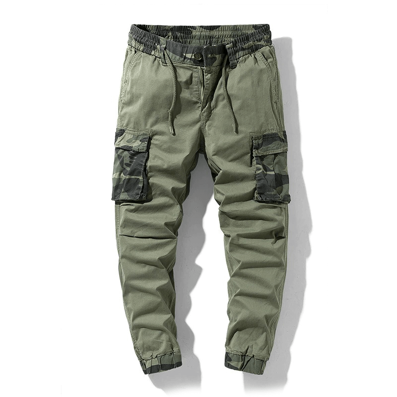 Men's joggers with camouflage elements in olive green, stylish streetwear with elastic waist and cargo pockets.