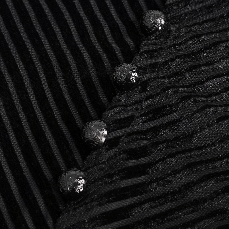 Close-up of black velvet top featuring textured leather strips and decorative button accents.