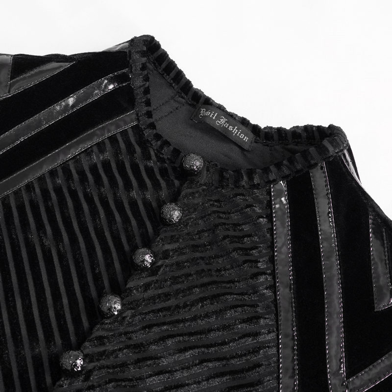 Close-up of men's black velvet top with leather strips and button accents, showcasing gothic fashion style.