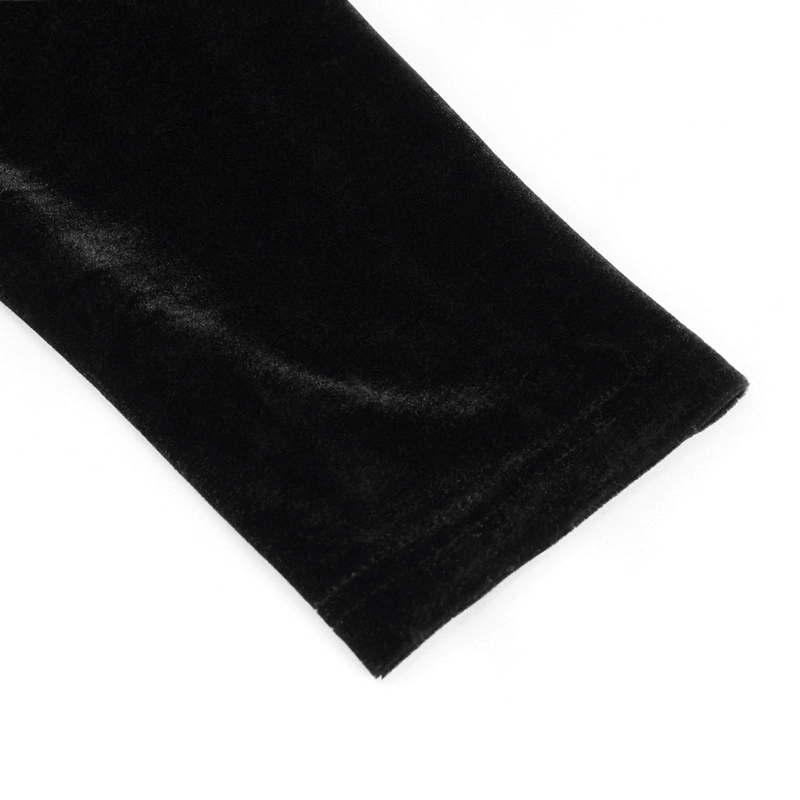 Close-up of the soft, black velvet sleeve of a men's gothic style top with leather strips.
