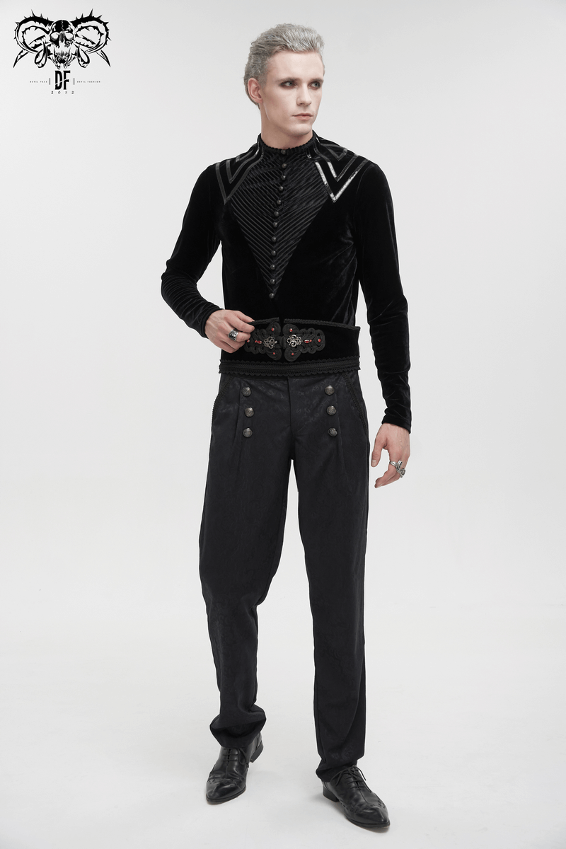 Men's gothic velvet top with leather strips, black long sleeves, buttoned accents, and stylish black pants.