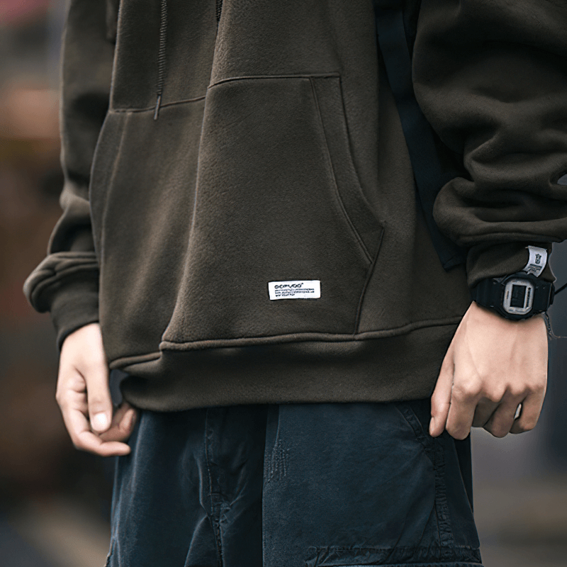 Men's loose-fitting fleece hoodie with drawstring, stylish alternative fashion, perfect for casual outfits.