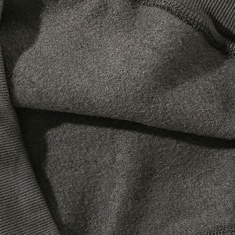 Close-up of the soft fleece fabric inside a men's letter hoodie, showcasing warmth and comfort for alternative style.