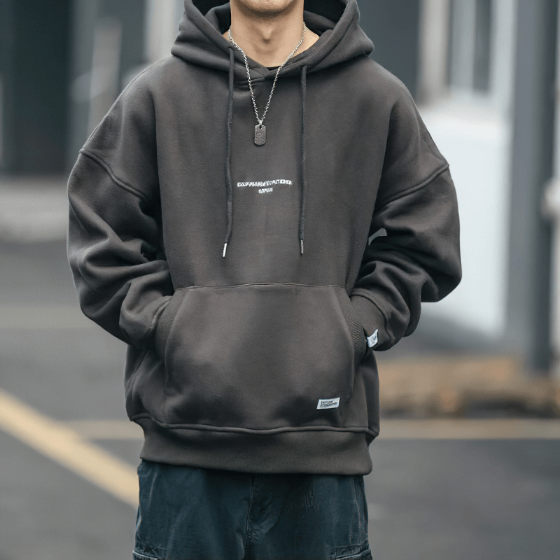 Men's loose fit fleece hoodie with drawstring, perfect for alternative fashion lovers.