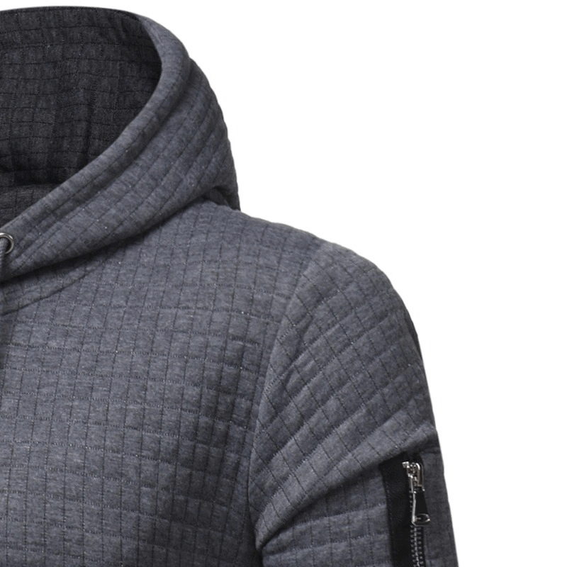 Close-up of a men's gray long sleeve hoodie with a modern quilted design and stylish zipper details.