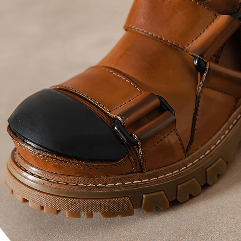 Close-up of men's luxury punk rock leather shoes with non-slip rubber sole and stylish black toe cap.