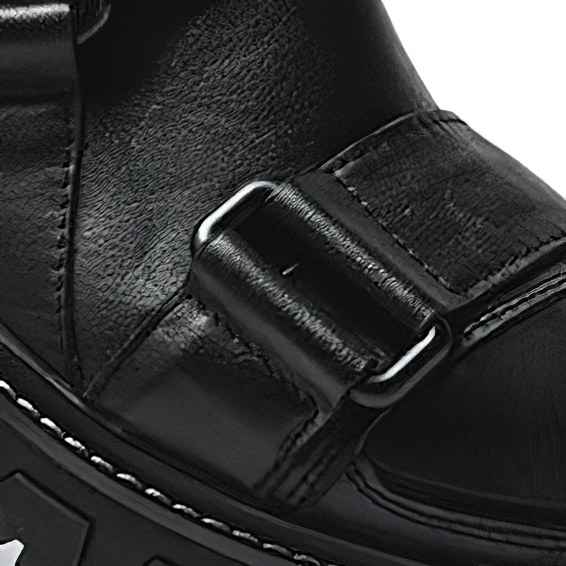 Close-up of men's luxury genuine leather punk rock shoes featuring a stylish buckle and non-slip rubber platform.