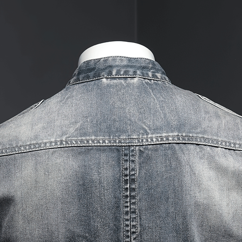 Back view of a men's zipper denim jacket, showcasing a trendy, slim fit design and classic stand collar style.