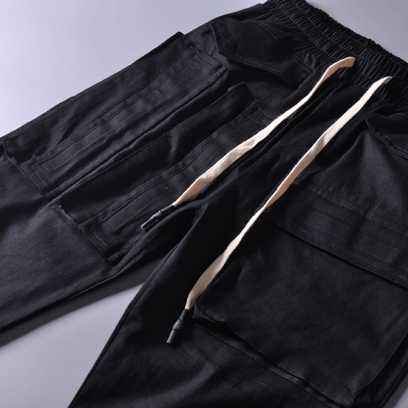 Men's black cargo joggers with multi-pocket design and adjustable drawstring waistband for a stylish look.