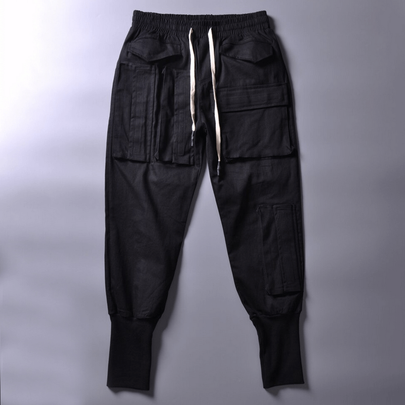 Men's black cargo joggers with multiple pockets, stylish cut for trendy alternative apparel.