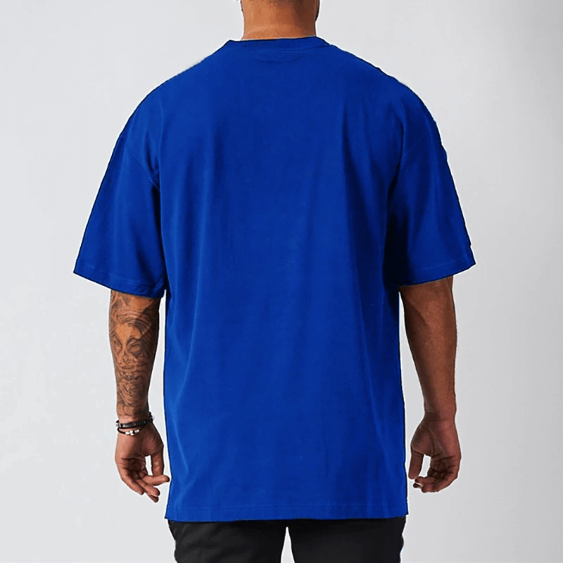 Back view of men's oversized fit blue short sleeve t-shirt with dropped shoulder, perfect for casual wear.