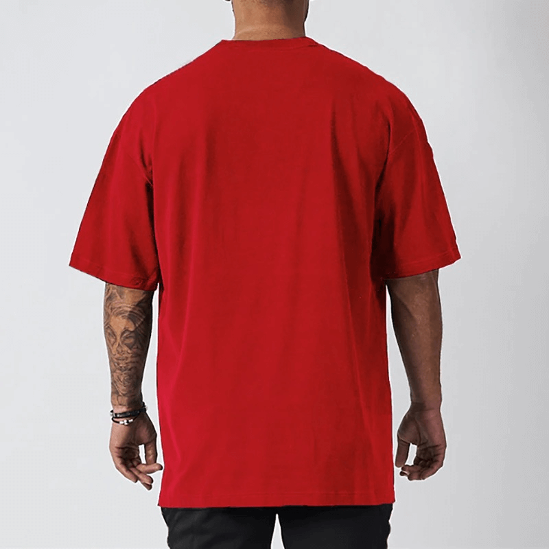 Men's oversized red short sleeve t-shirt with dropped shoulders, perfect for casual fitness and stylish everyday wear.
