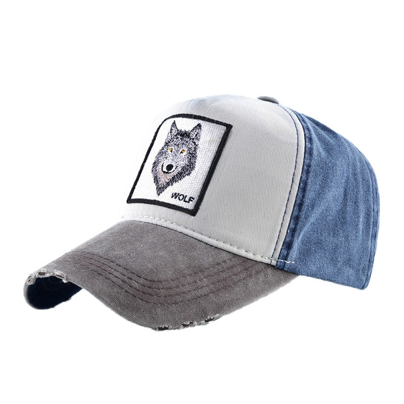 Unisex wolf embroidery baseball cap in washed denim and cotton, perfect for festivals or outdoor adventures.