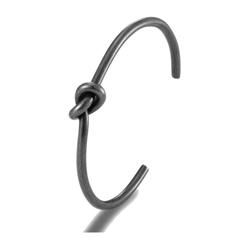 Men's alternative style bracelet in stainless steel featuring a sleek knot design for a bold, modern look.