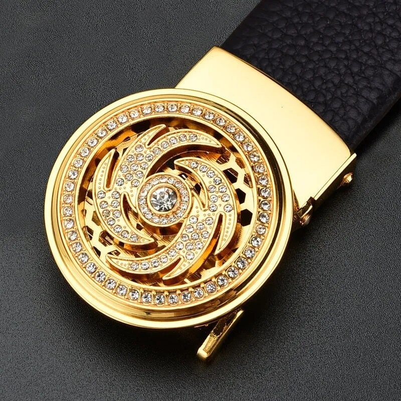 Elegant gold automatic buckle with intricate design and sparkling rhinestones on a black leather belt.