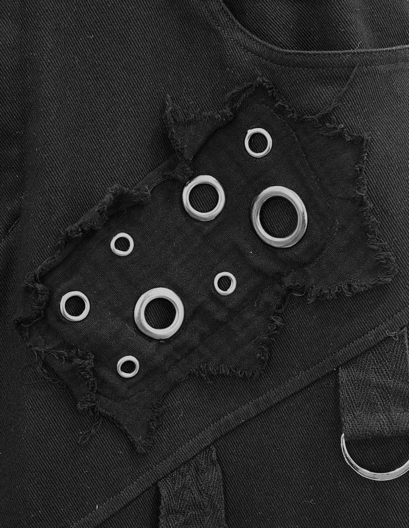 Close-up of punk-style black pants featuring silver rivets and creative lace details for a stylish look.