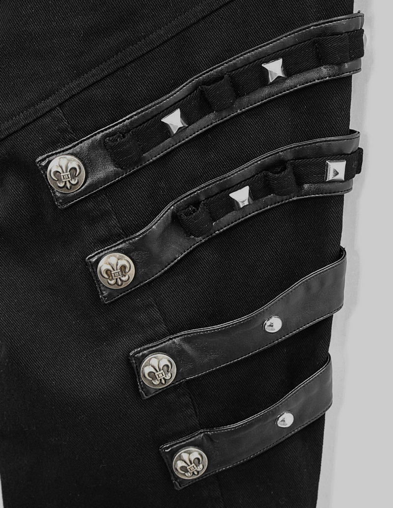 Close-up of men's black punk pants with silver studs and unique lacing detail, showcasing edgy style and craftsmanship.