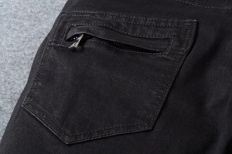 Close-up of men's black biker jeans pocket with zipper detail, perfect for goth and rock fashion styles.
