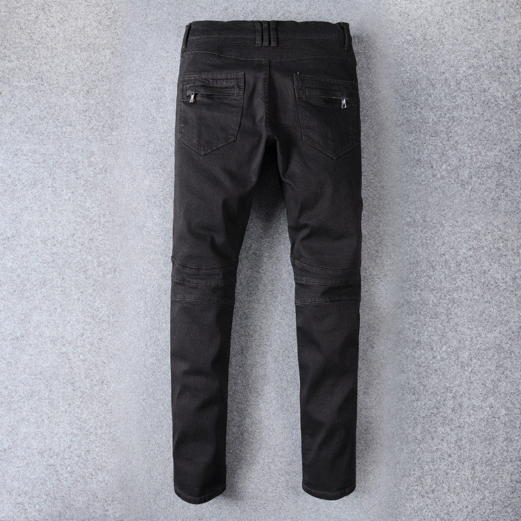 Men's black biker jeans with pleated decor, perfect for goth and rock styles, featuring a stylish fit and unique back pockets.