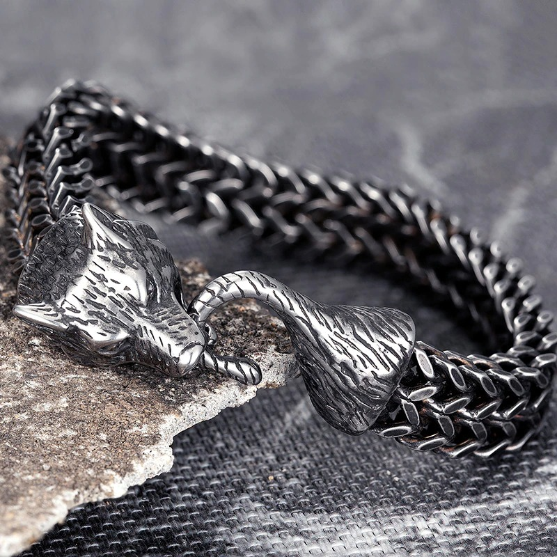 Stylish men's black wolf head bracelet crafted from vintage stainless steel, showcasing a unique chain design.