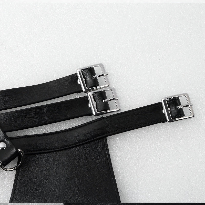 Close-up of adjustable faux leather body harness straps featuring silver buckles for a stylish men's lingerie look.