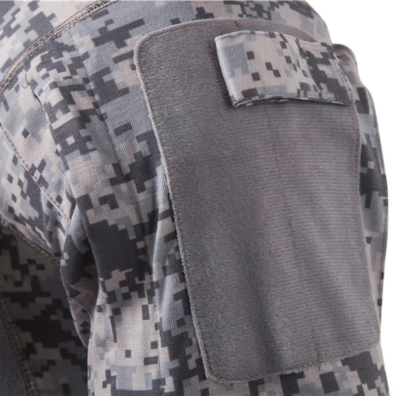 Close-up of camouflage military sweatshirt sleeve featuring a stylish patch detail.