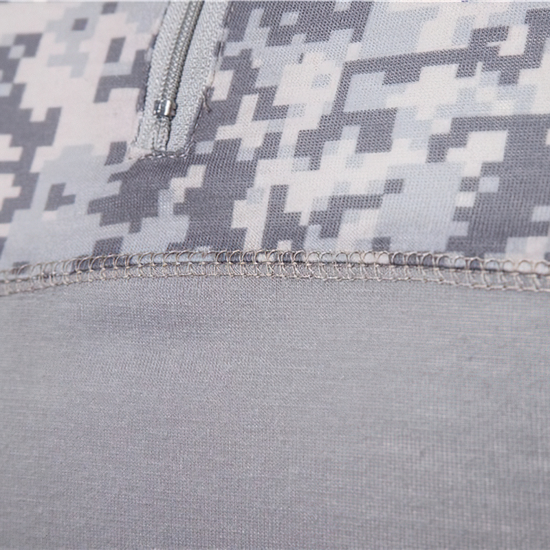 Close-up of men's camouflage tactical sweatshirt fabric showcasing unique design and sturdy stitching details.