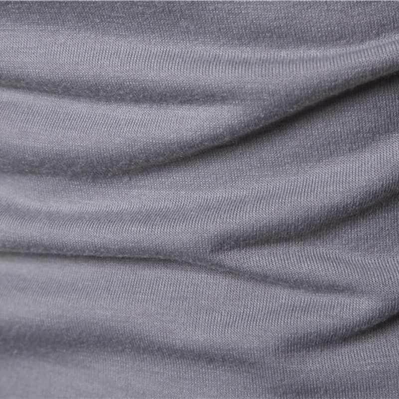 Close-up of soft gray fabric showcasing the texture and stretch of military-style sweatshirt material.