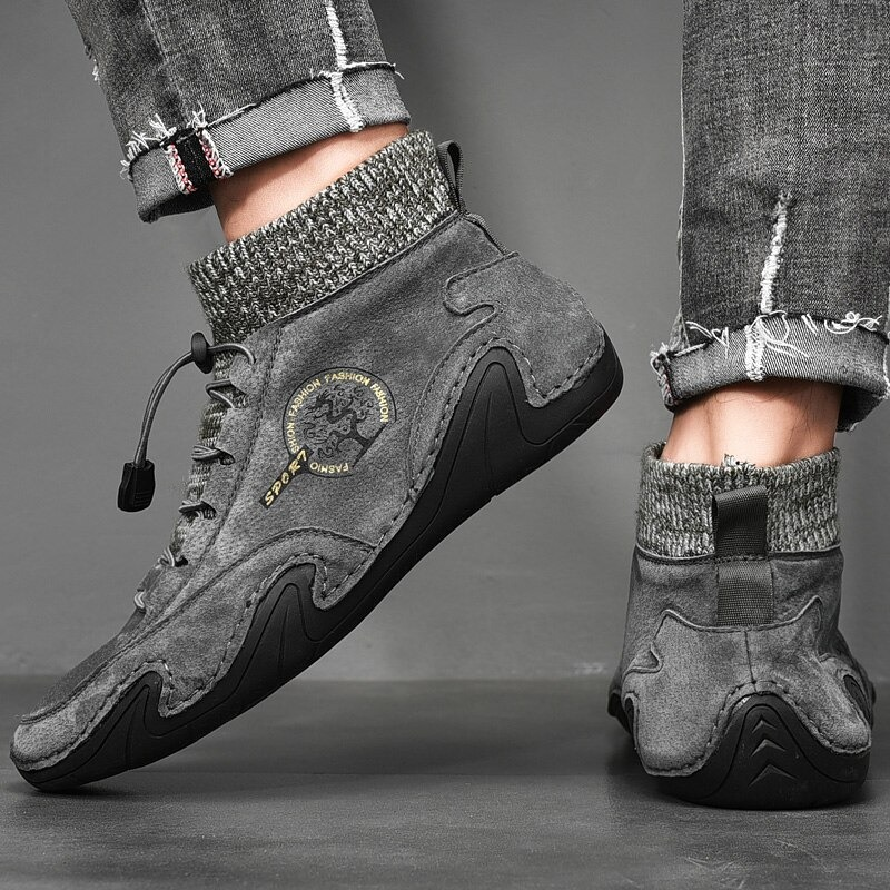 Men's casual sneakers in grey suede with a stylish knitted collar for comfort and breathability.