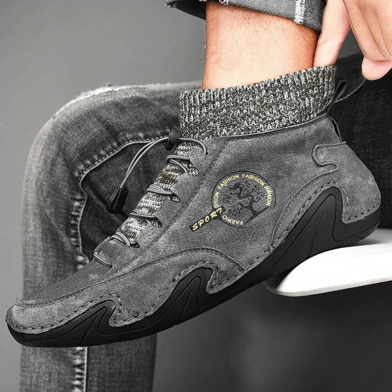 Men's trendy grey sneakers with a stylish design and knitted sock cuff, perfect for casual wear.