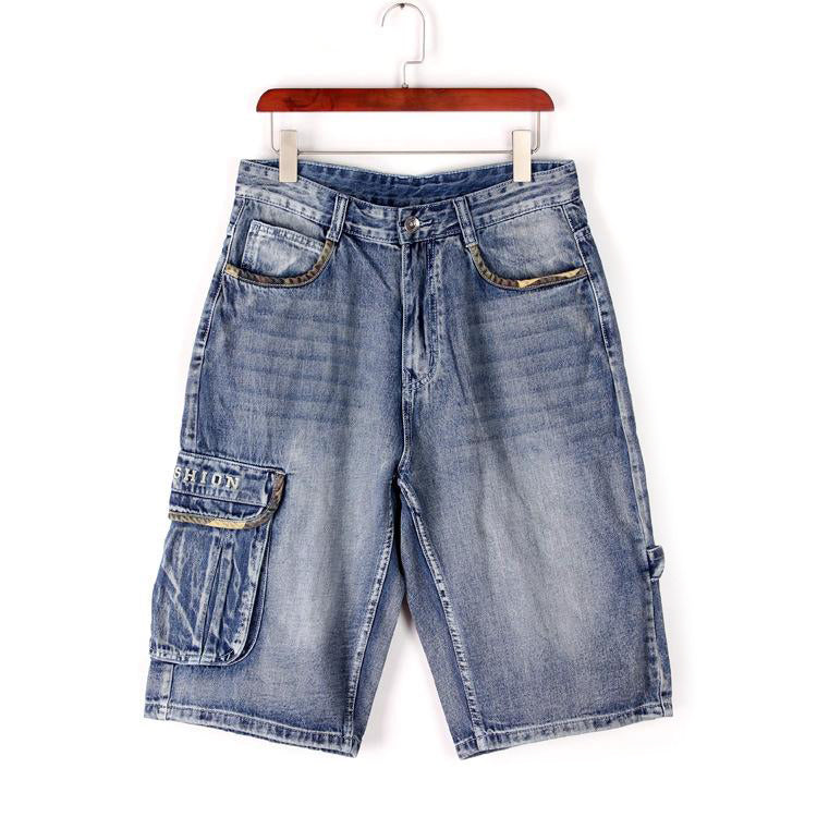Men's blue denim cargo shorts with pockets, showcasing a loose fit and stylish design for streetwear fashion.