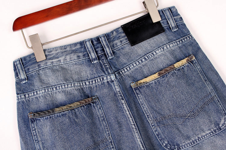 Back view of men's baggy denim cargo shorts showcasing functional pockets and a relaxed fit.