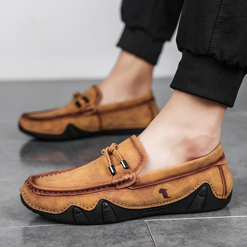 Stylish men's handmade moccasins in tan PU leather, perfect for casual wear and comfortable outings.