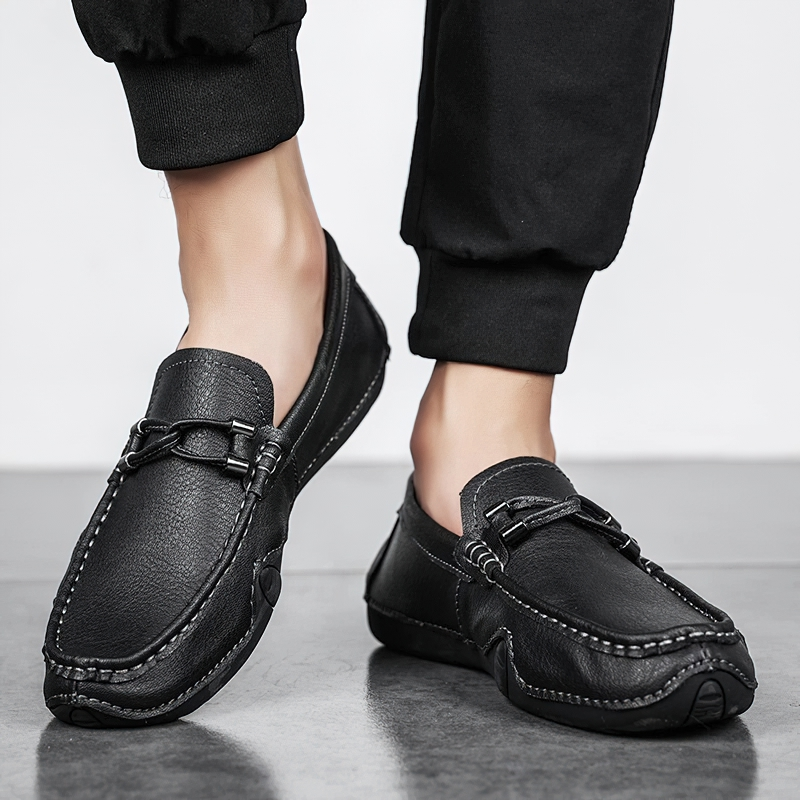 Men's black PU leather loafers showcasing sleek handmade moccasin design for casual style.