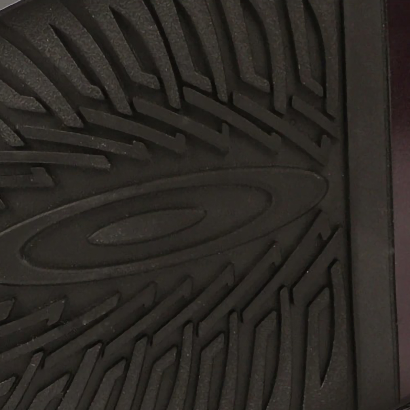 Close-up of the durable textured sole of men's leather boots, showcasing quality grip and design.