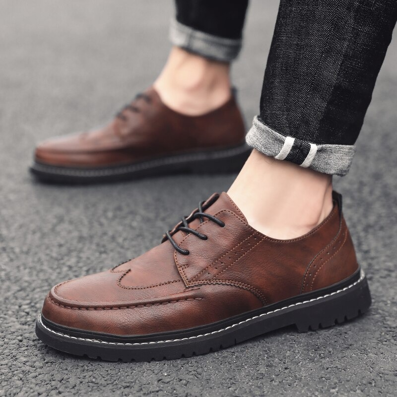 Men's brown leather dress shoes with lace-up design, stylish and comfortable non-slip flats for casual fashion.