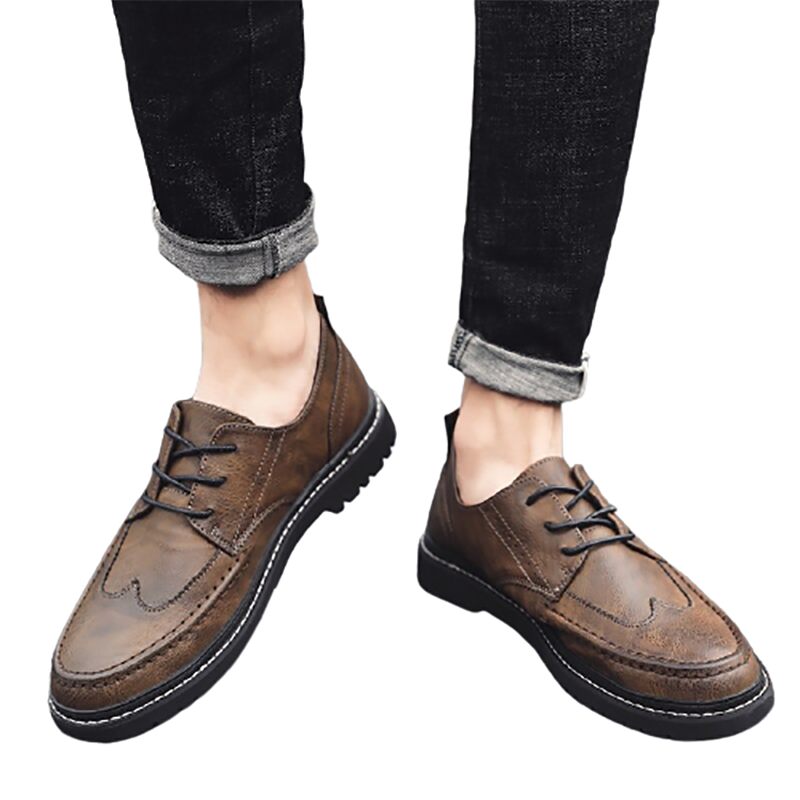 Men's brown leather lace-up dress shoes with flat soles in casual British style, perfect for a stylish outfit.