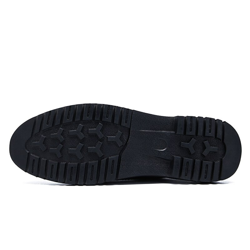 Black flat sole of men's leather dress shoes showcasing non-slip design for enhanced comfort and style.