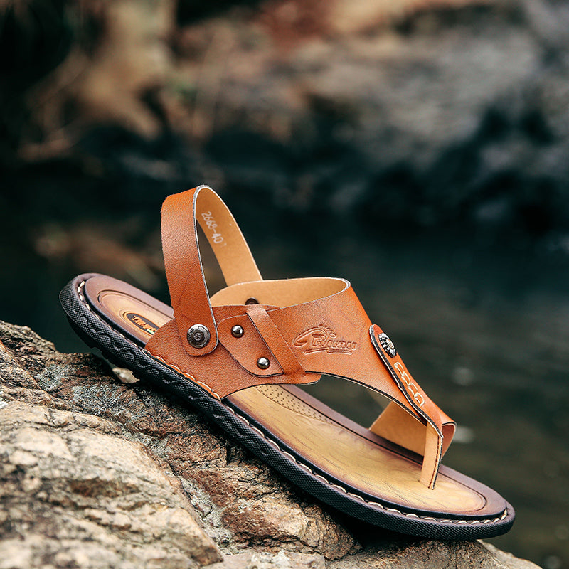 Men's leather sandals in a natural setting, perfect for summer leisure activities and casual styling.
