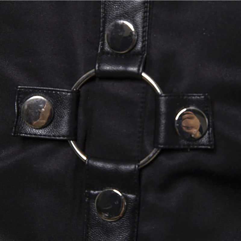Close-up of silver rivets and circular ring on a black gothic style shirt.