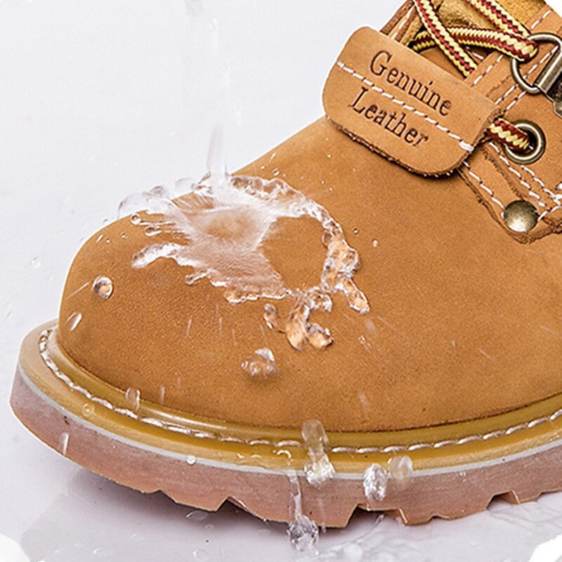 Close-up of a men's genuine leather military boot with water droplets showcasing its waterproof feature.